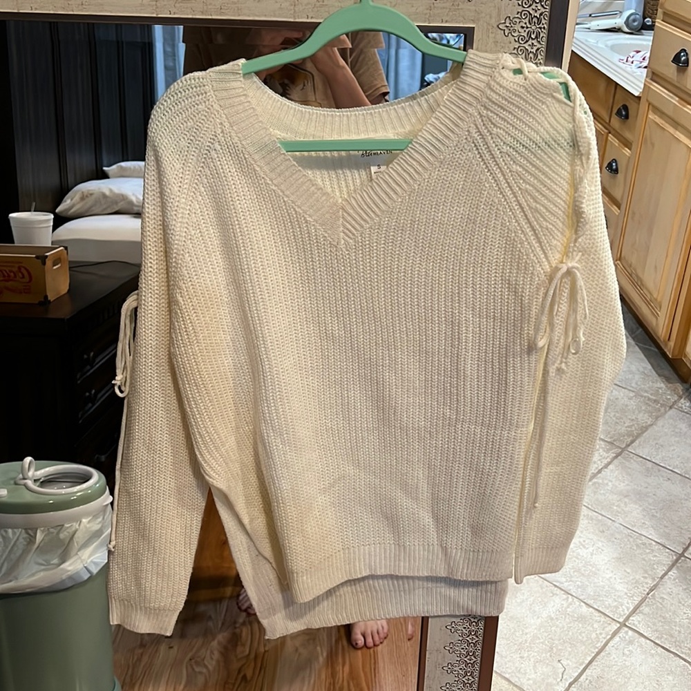 Sweater with open sides
